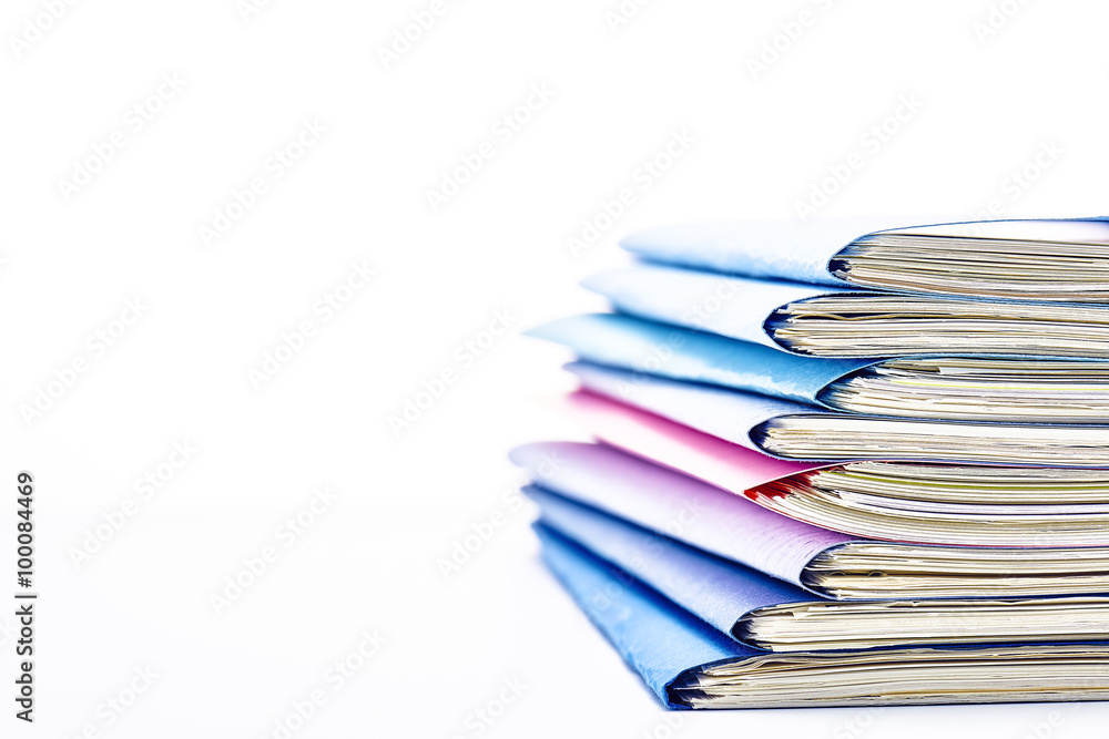 Stacked files. On white background with copy space on the left side. Stacked files. On white background with copy space on the left side.