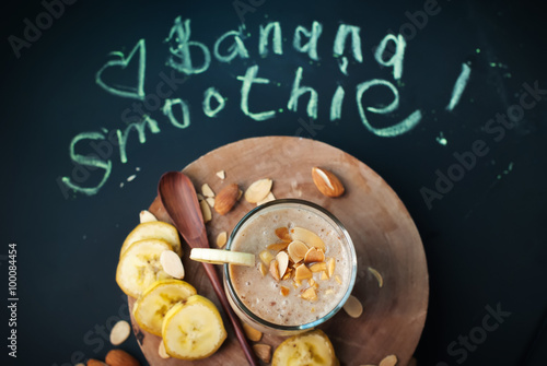 Fruit banana smoothies with letters on black chalkboard