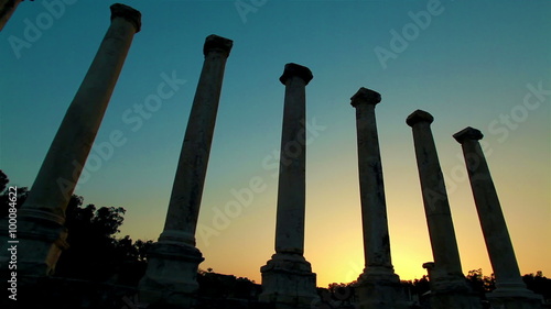 Stock Footage of ancient silhouetted columns at sunset in Israel. photo