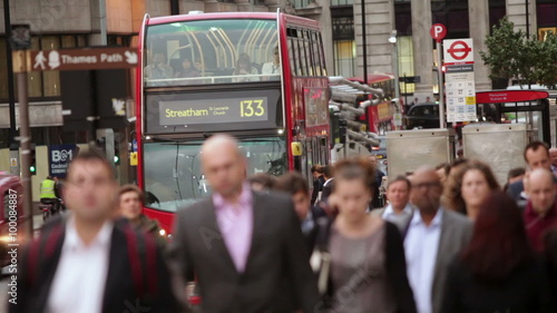 London Bridge with busy people walking, crowd with double decker bus.