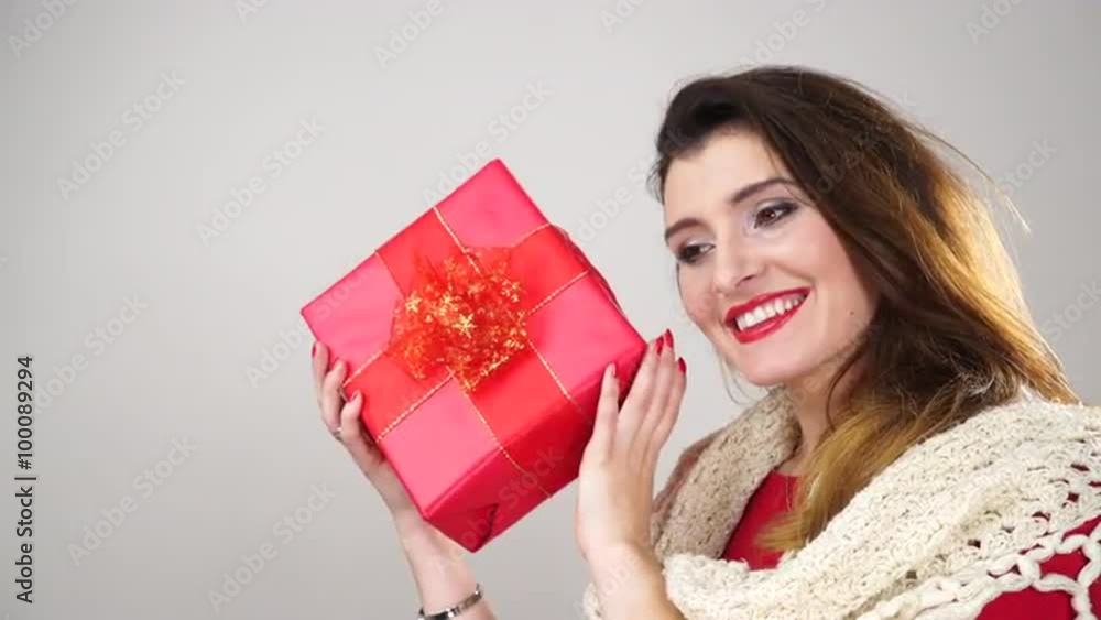 Woman shaking present gift box for christmas 4K. Woman shaking present gift box for christmas 4K.