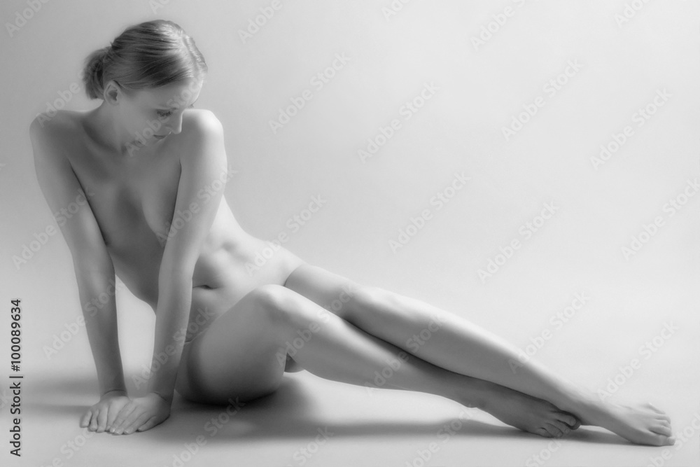 Fototapeta premium Beautiful sitting nude woman. Film grain.