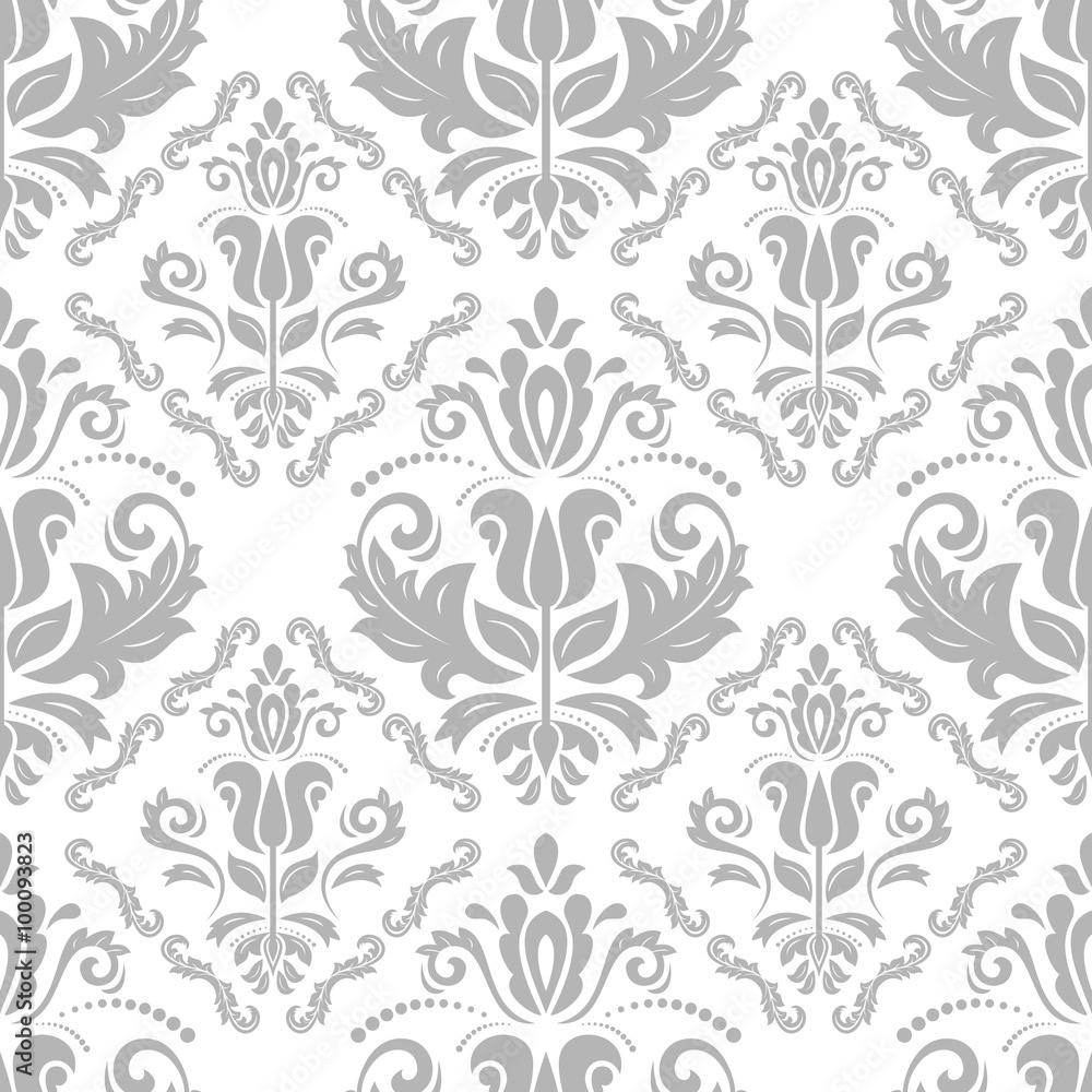Damask seamless ornament. Traditional silver pattern. Classic oriental background Damask seamless ornament. Traditional silver pattern. Classic oriental background
