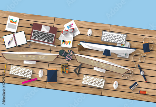 Flat design - place of work - Top view of desk of wood that have laptop and desktop and many others objects (documents,smart-phone, tablet,...) the image represent a place of work and business concept