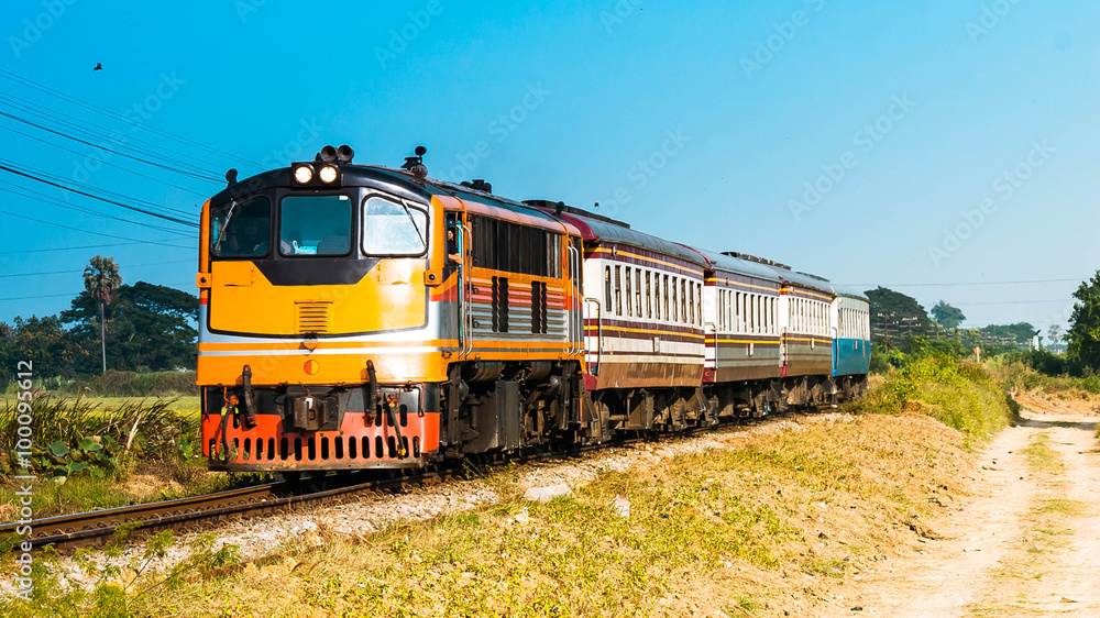 Passenger train was passing through rural field, 2015. Passenger train was passing through rural field, 2015.