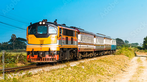 Passenger train was passing through rural field, 2015.