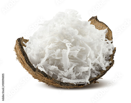 Freshly grated coconut in shell isolated on white background