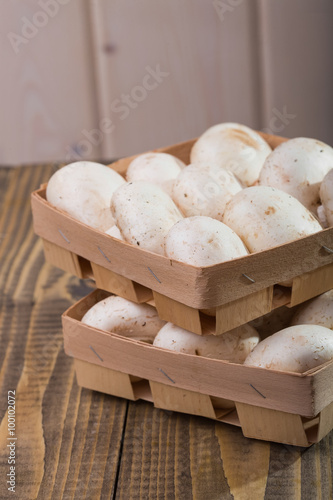 Two baskets with champignons