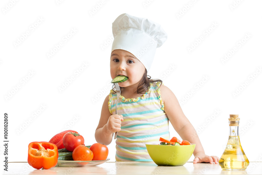 Chef girl preparing and tasting healthy food over white background Chef girl preparing and tasting healthy food over white background