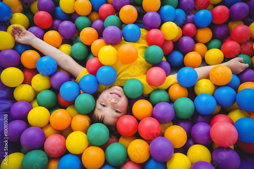 Photos Cute smiling boy in sponge ball pool