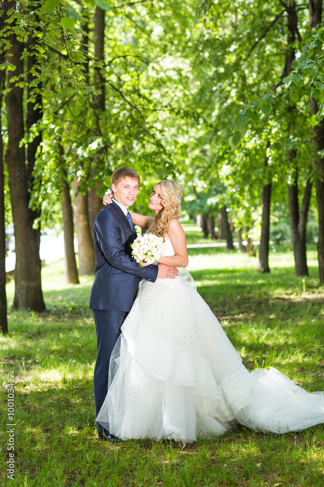 Bride and groom having a romantic moment on their wedding day Bride and groom having a romantic moment on their wedding day