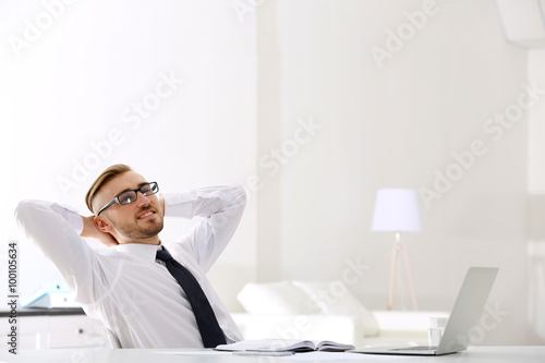 Businessman working with la...
