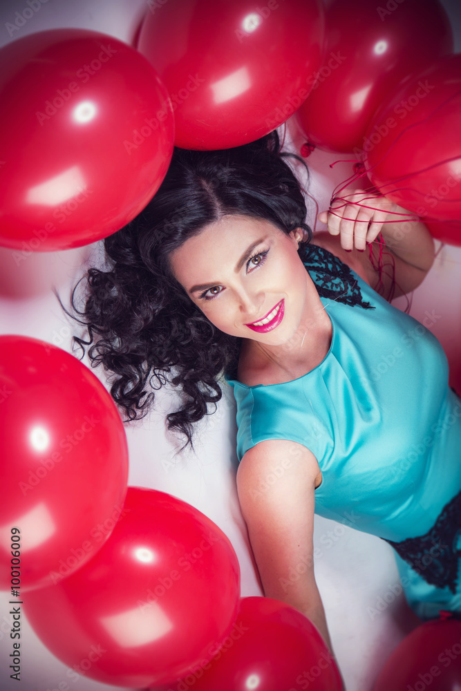 Happy young woman with red latex balloons Happy young woman with red latex balloons