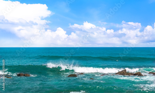 Big wave with sea foam and turquoise water. © kuzina1964