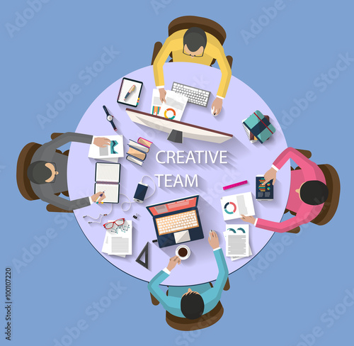 Flat design - business concept - top view of creative team working together around a desk with a desktop, laptop, tablet and other objects , trying to find new and bright ideas for the company.