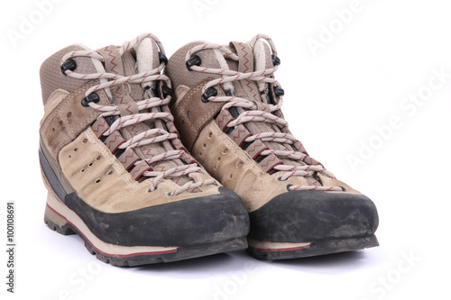 Used hiking boots isolated on white background