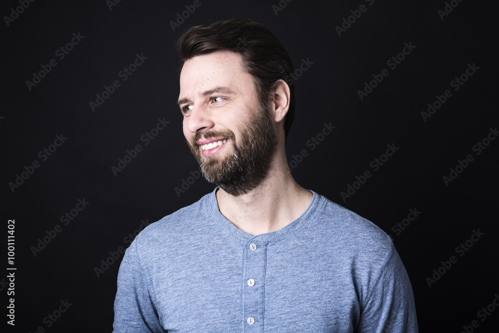 Obraz premium Portrait of a men with beard and mustache in studio black background