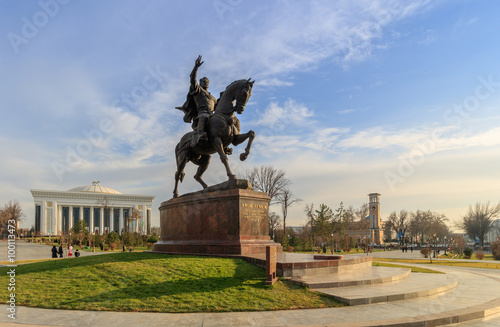 Statue of Tamerlane and Palace of Forums in center of Tashkent at sunset, Uzbekistan