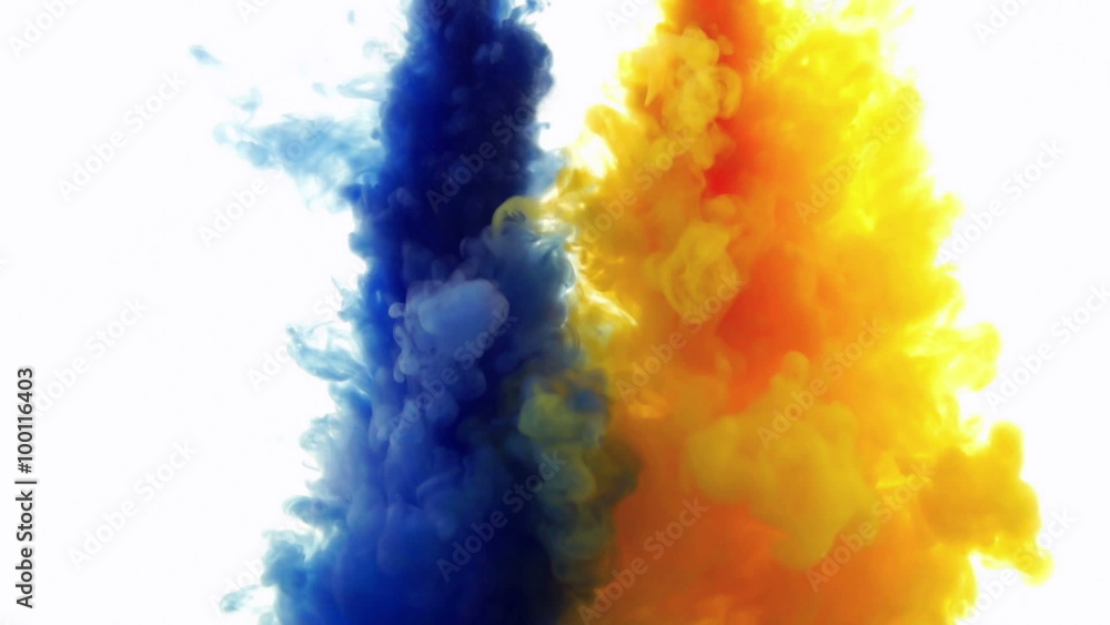 Blue and yellow ink reacting in water.Creative slow motion. On a white background. Blue and yellow ink reacting in water.Creative slow motion. On a white background.
