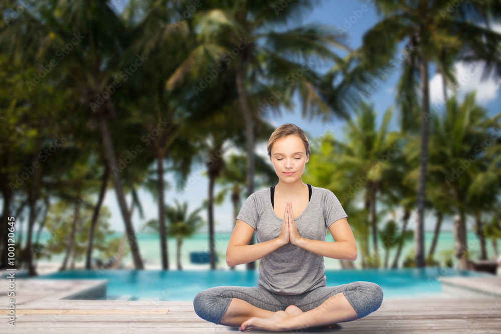 woman making yoga meditation in lotus pose