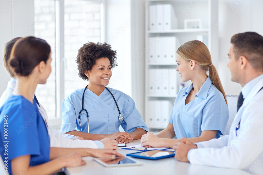 group of happy doctors meeting at hospital office group of happy doctors meeting at hospital office
