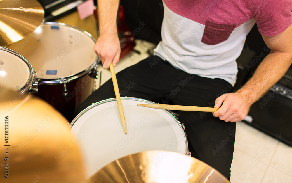 close up of male musician playing on drum kit close up of male musician playing on drum kit