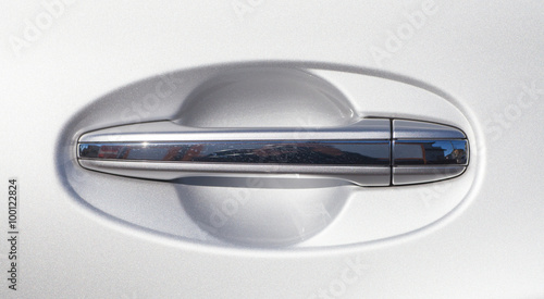 Car door handle at silver modern car.