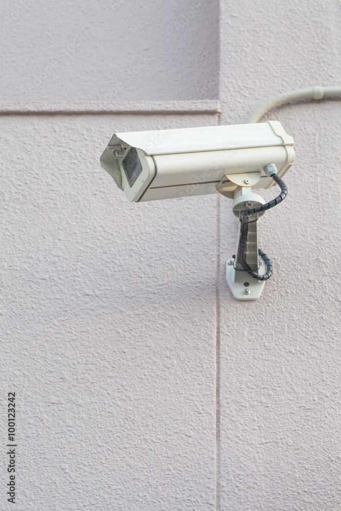 Video camera security system on the wall of the building Video camera security system on the wall of the building