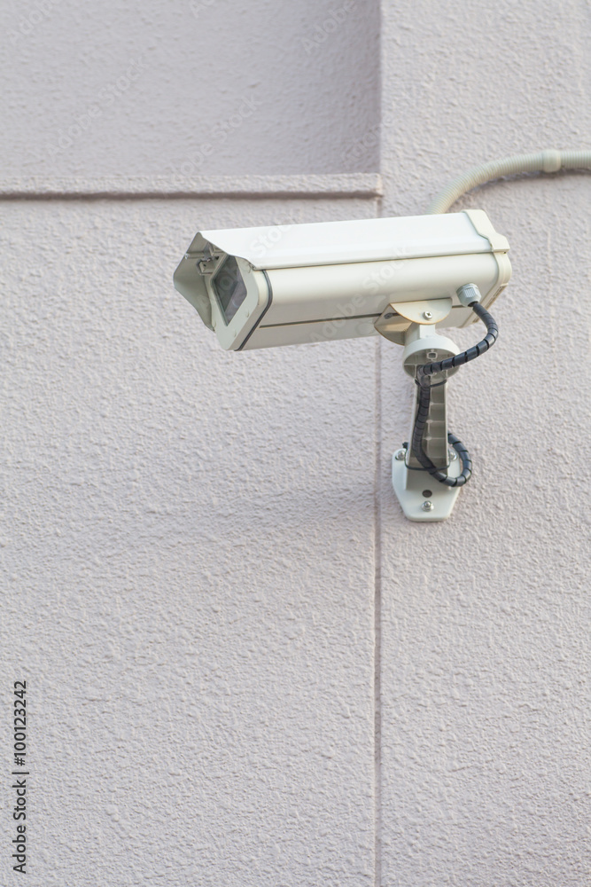 Video camera security system on the wall of the building