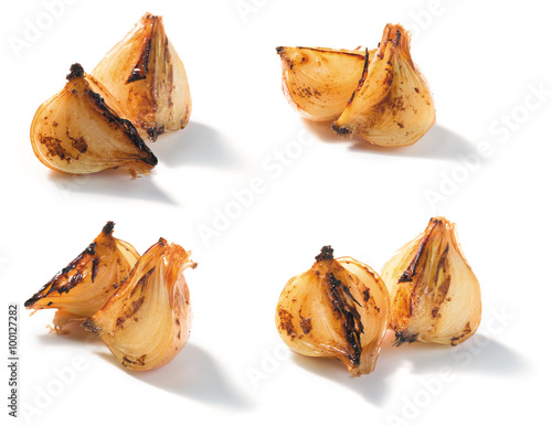 roasted onion pieces on a white background. closeup