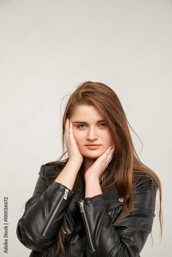 Glamorous woman in black leather jacket isolated on white background Glamorous woman in black leather jacket isolated on white background