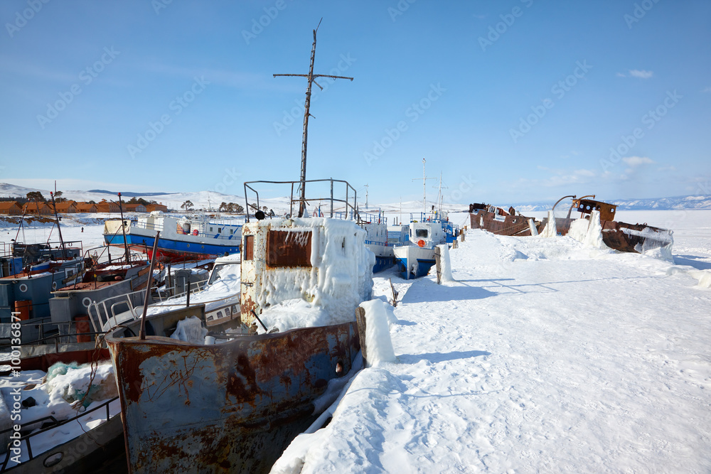 Old frozen ships in the port of Olkhon island on siberian lake B