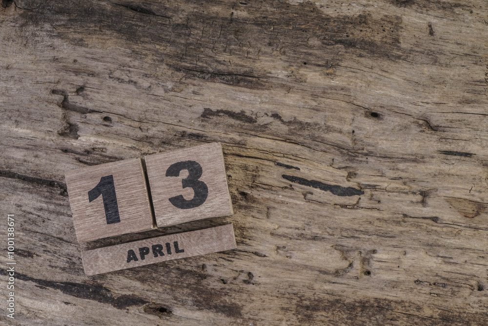 cube calendar on wooden surface for april with copy space cube calendar on wooden surface for april with copy space