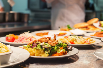 Food orders on the kitchen table in the restaurant