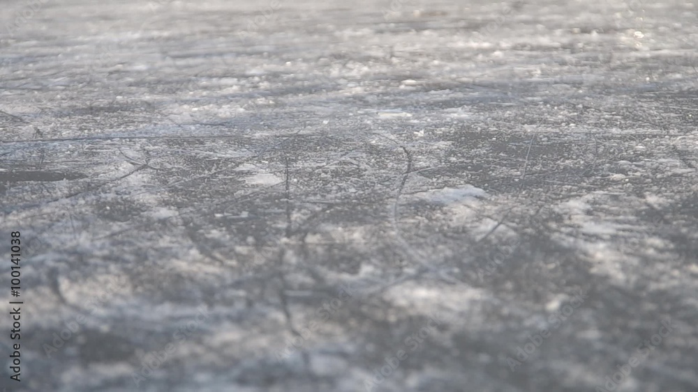 Ice skating on a frozen lake with old skates in winter
Ice skating on a frozen lake with old skates in winter