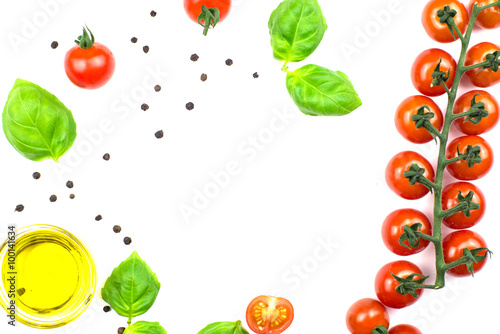 Cherry tomatoes, olive oil and basil isolated on white. 
