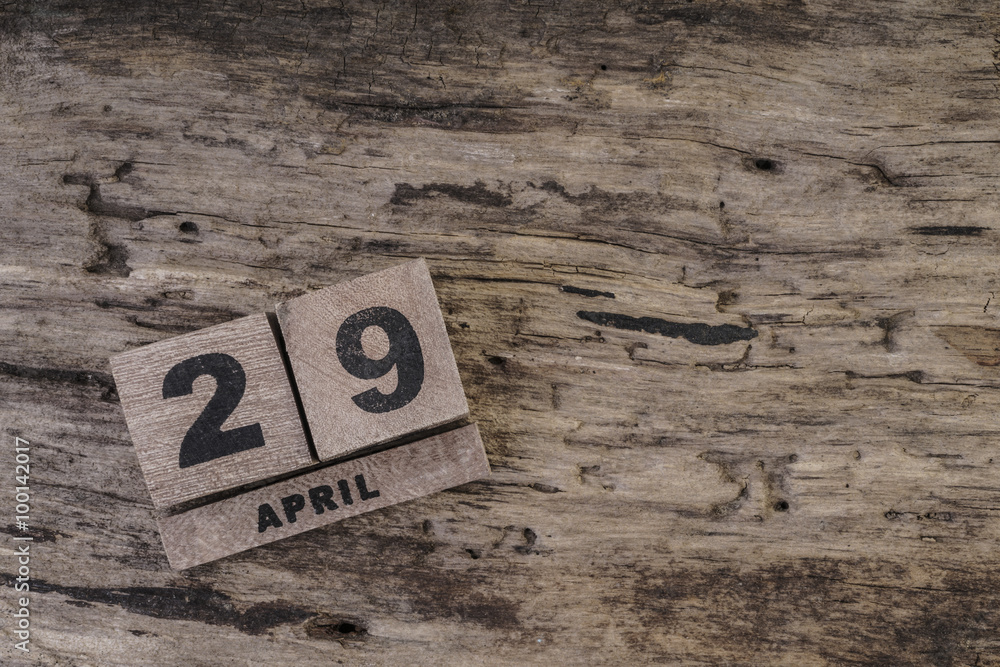 cube calendar on wooden surface for april with copy space cube calendar on wooden surface for april with copy space