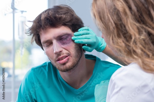 Male patient with black eye photo