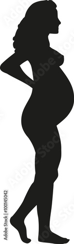 Silhouette of standing pregnant woman
