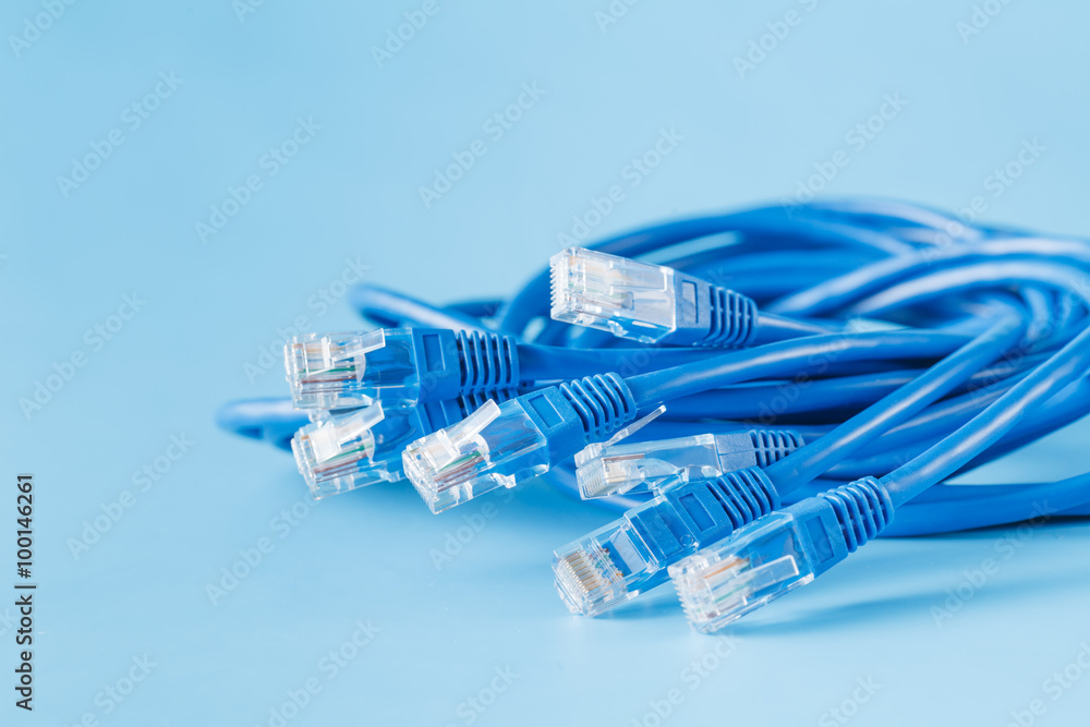 blue computer ethernet cable on blue background foto de Stock | Adobe Stock