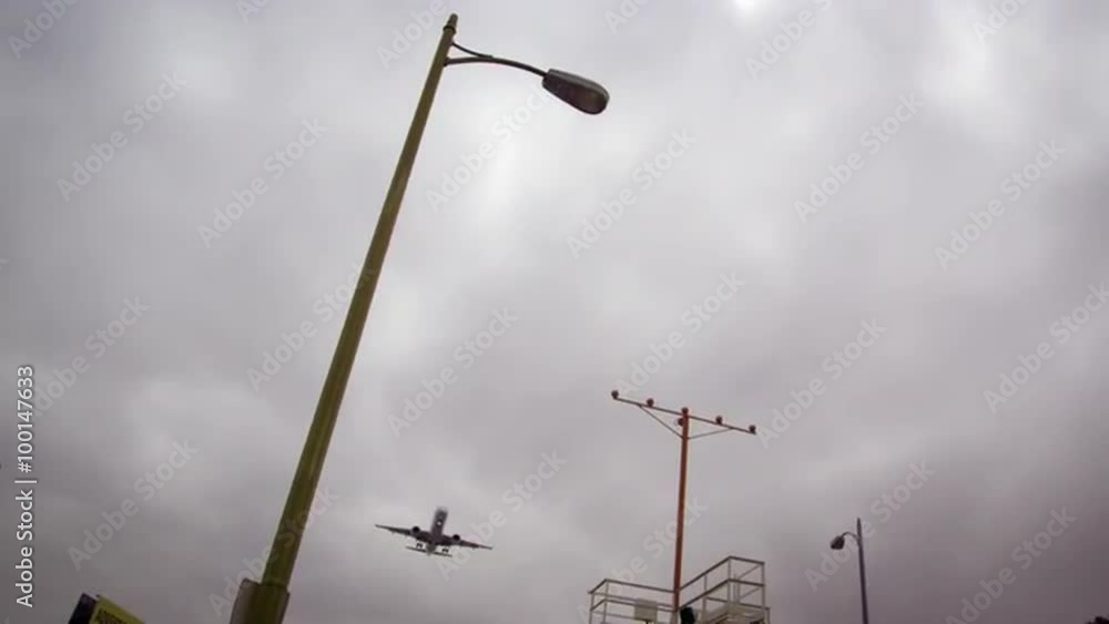 Low-angle rotating shot of airplane flying into LAX Low-angle rotating shot of airplane flying into LAX