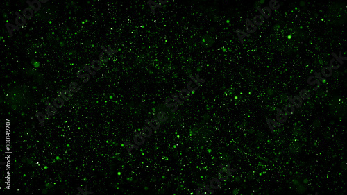 a lot of small shiny particles with different scale covered dark background