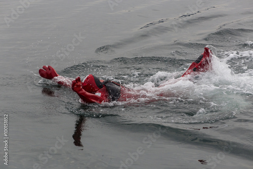 фотографія Swimming in an immersion suit