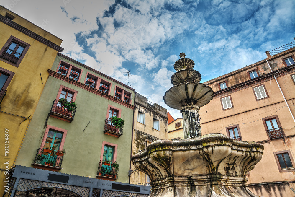 Fountain and buildings in Bosa