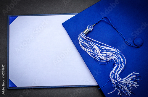 Graduation Day. Mortarboard, tassel  and blank diploma with copy space.