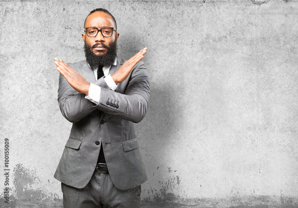 business black man doing a cross with arms business black man doing a cross with arms