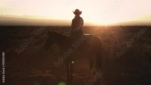 Static shot of a cowboy sitting on a horse