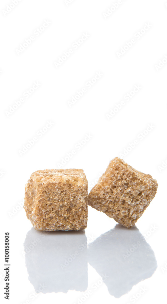 Brown sugarcane sugar cube over white background Brown sugarcane sugar cube over white background