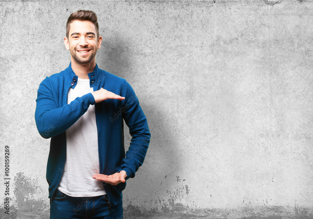 young man holding something young man holding something