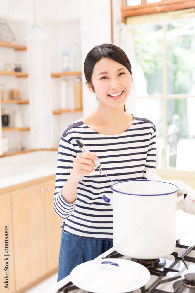 attractive asian woman in the kitchen attractive asian woman in the kitchen